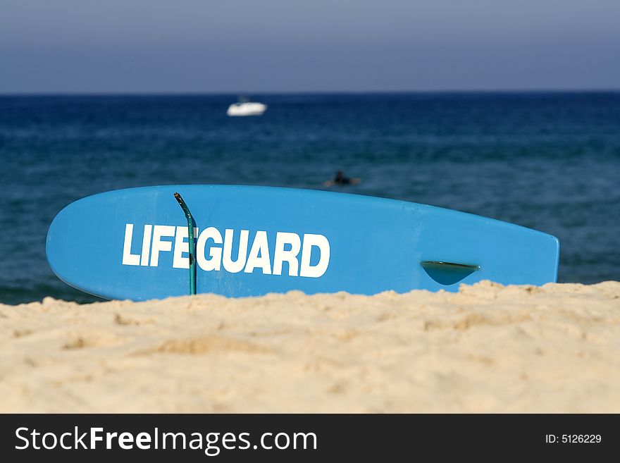 Lifegaurd surfboard on beach in Surfers Paradise, Australia. Lifegaurd surfboard on beach in Surfers Paradise, Australia.