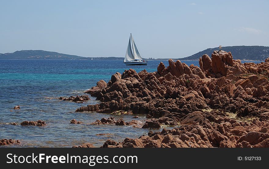 A view of sailboat in sardinian sea near Tavolara Island.