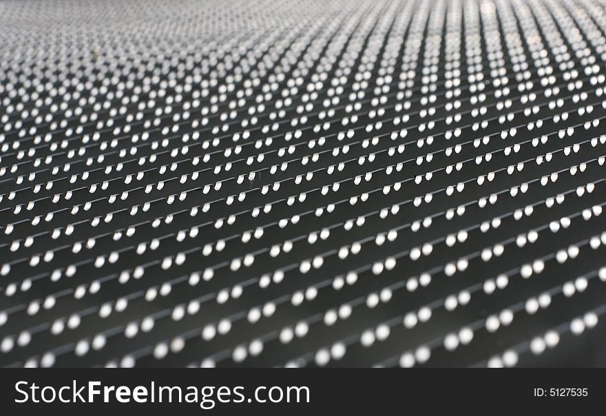 Metallic architectural structure close-up details shot in low angle. Interesting pattern texture. Metallic architectural structure close-up details shot in low angle. Interesting pattern texture