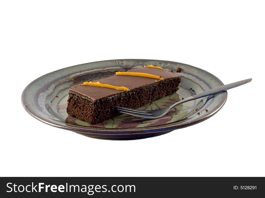 Chocolate cake and a fork on a plate