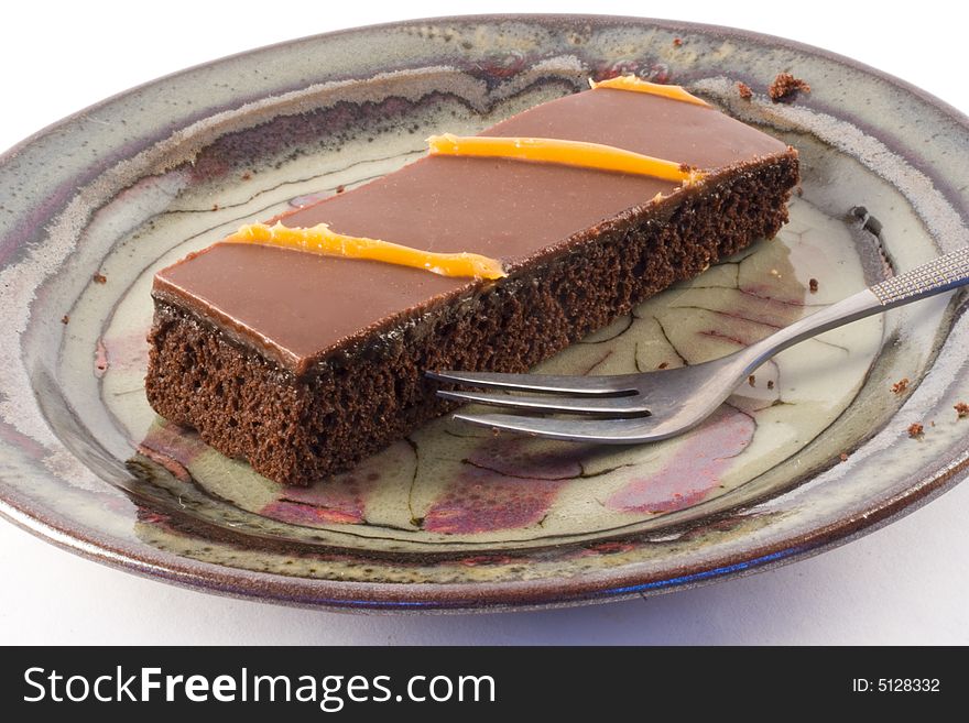 Chocolate cake and a fork on a plate