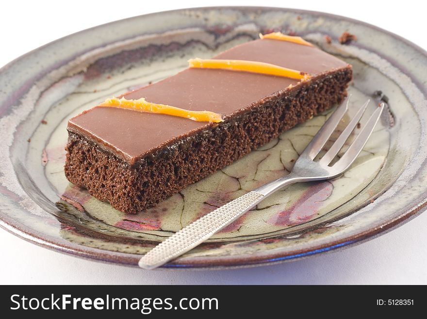 Chocolate cake and a fork on a plate