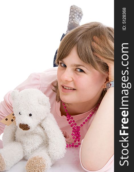The young girl with a teddy bear isolated