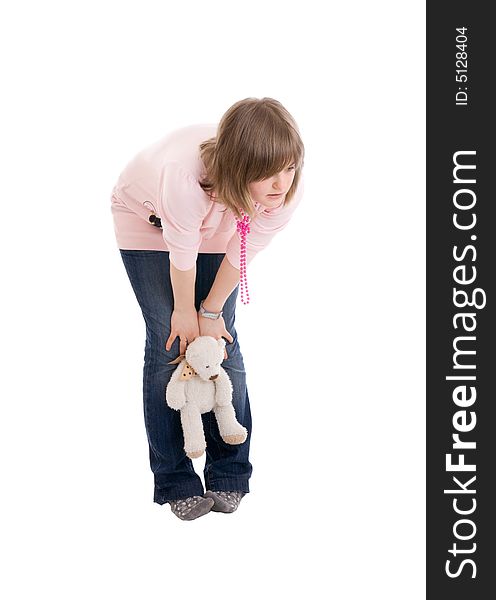 The young girl with a teddy bear isolated on a white background