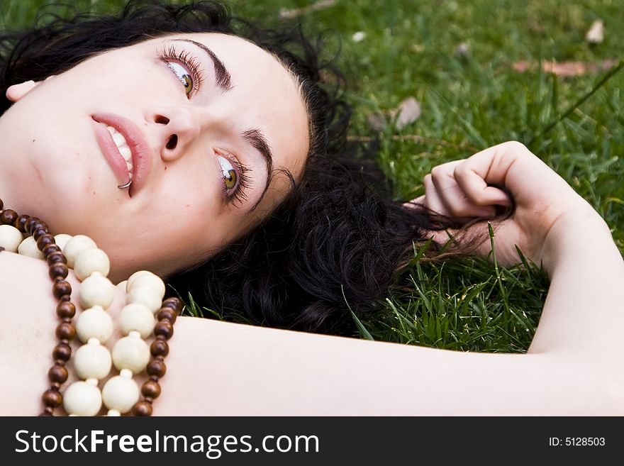 Woman Laying On The Grass