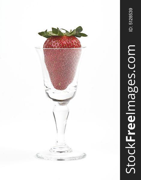Strawberry in a glass on a white background