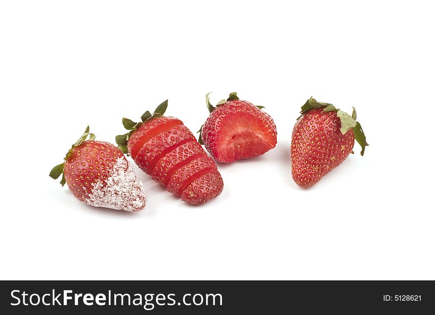 Strawberry - sliced, bitten and with sugar- ona white background