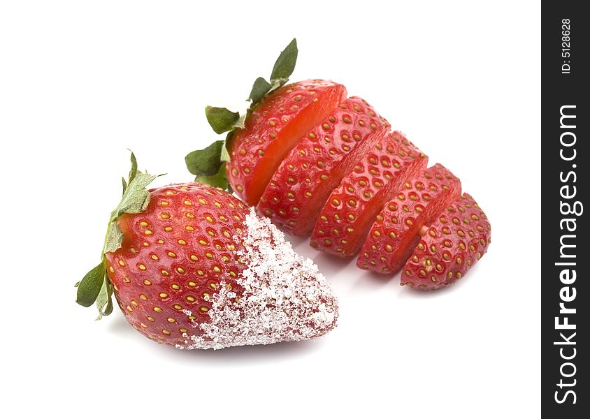 Strawberry - sliced and with sugar- on a white background