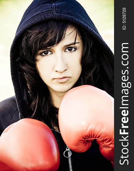 Young female boxer with red gloves. Young female boxer with red gloves
