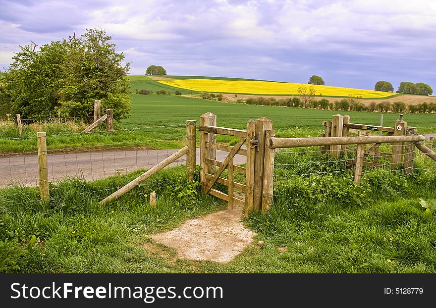 A landscape of the countryside around the Wiltshire village of Avebury, showing a gate to a public footpath in the foreground. A landscape of the countryside around the Wiltshire village of Avebury, showing a gate to a public footpath in the foreground.