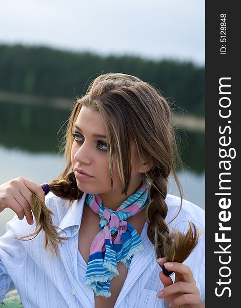 Portrait of young sexual girl on lake background