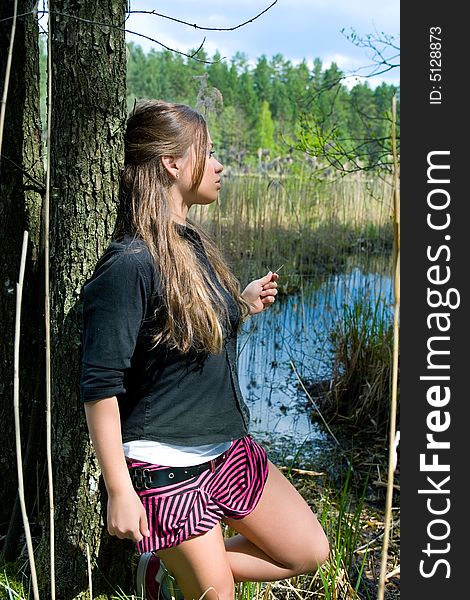 Portrait of young sexual girl on lake background