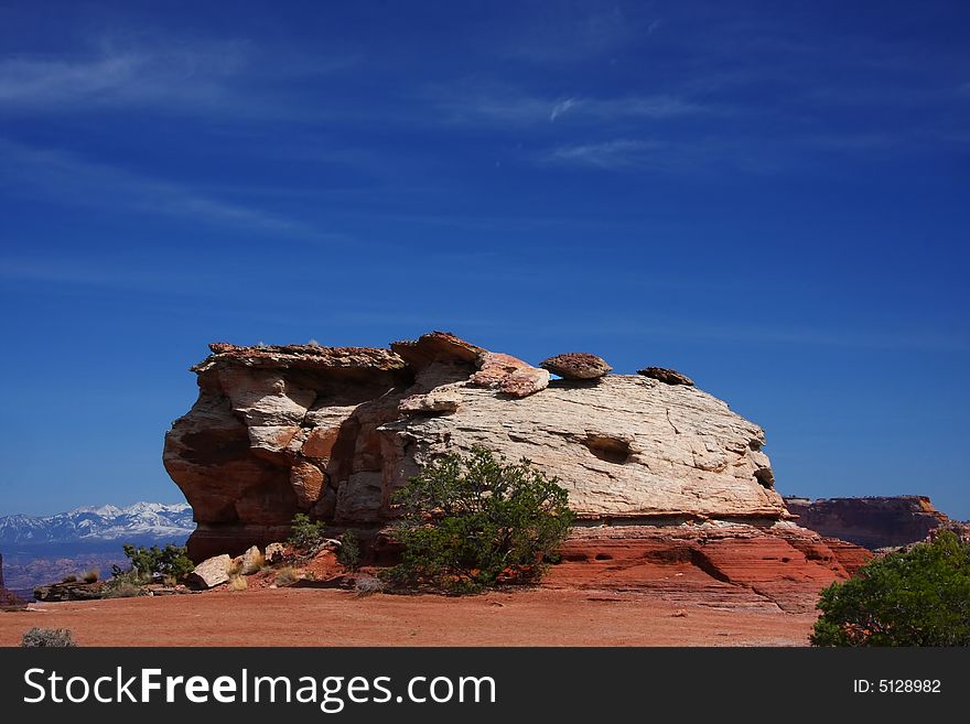 View of the red rock formations in Canyonlands National Park with blue sky�s and clouds. View of the red rock formations in Canyonlands National Park with blue sky�s and clouds