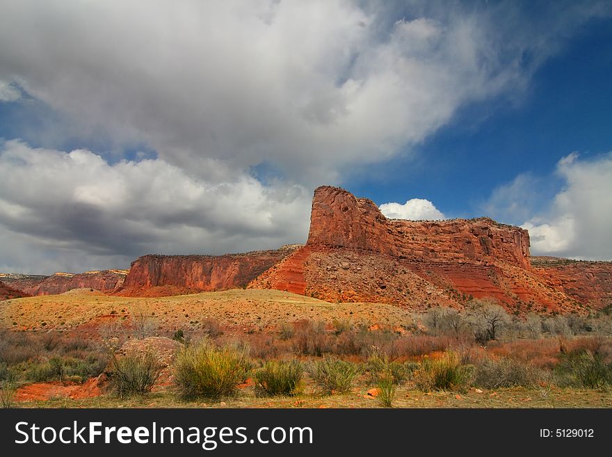 View of the red rock formations in Canyonlands National Park with blue sky�s and clouds. View of the red rock formations in Canyonlands National Park with blue sky�s and clouds