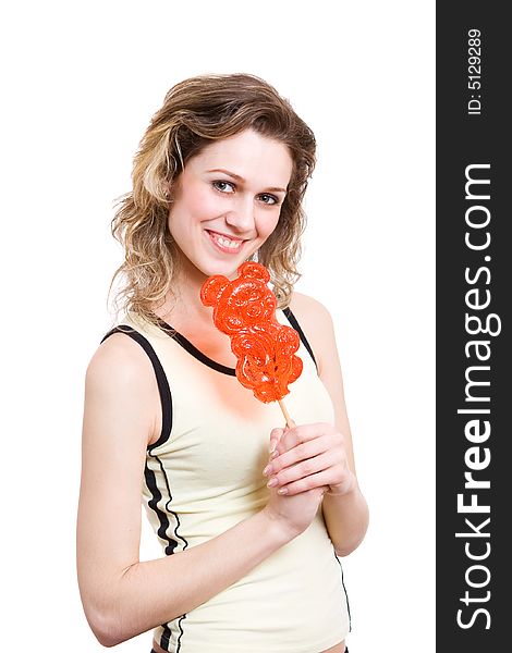Girl with red lollipop in yellow clothes.Isolated in white. Girl with red lollipop in yellow clothes.Isolated in white.