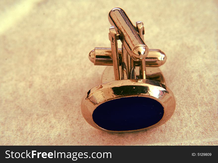 A pair of blue cuff links