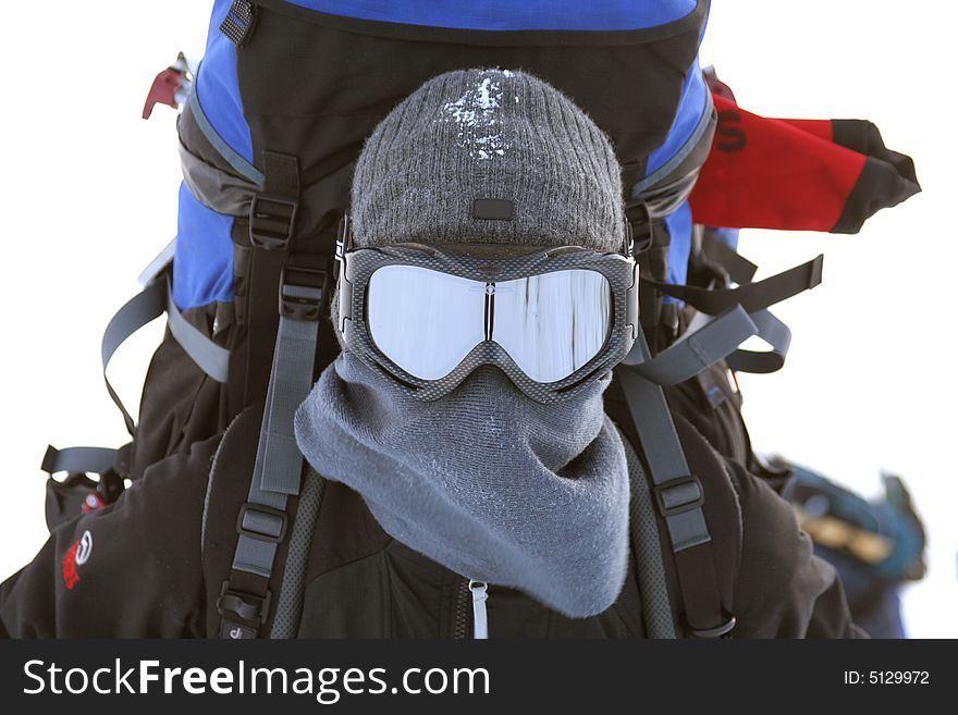 Portrait of tourist in a winter mask with a backpack. Portrait of tourist in a winter mask with a backpack