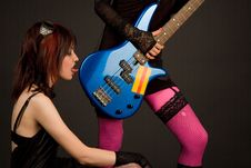 Rock Girl Licking Bass Guitar Stock Photography Rock Girl Licking Bass Guitar Stock Photography