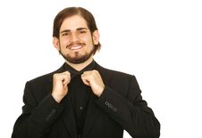 Man In Tuxedo Holding His Bow Tie Royalty Free Stock Image