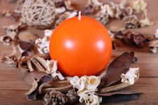 Orange Candle And Dried Plants Royalty Free Stock Photo Orange Candle And Dried Plants Royalty Free Stock Photo