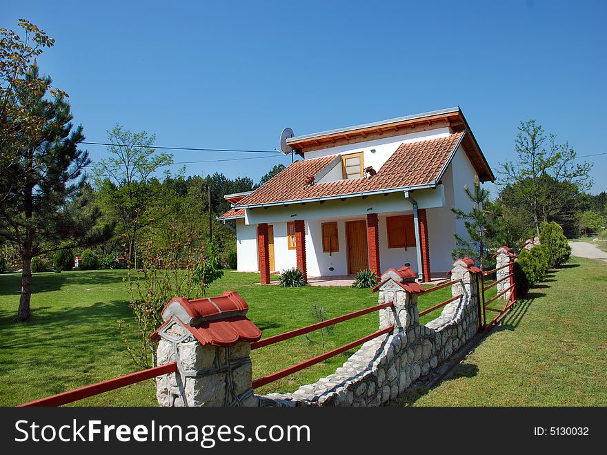 House with stone fence