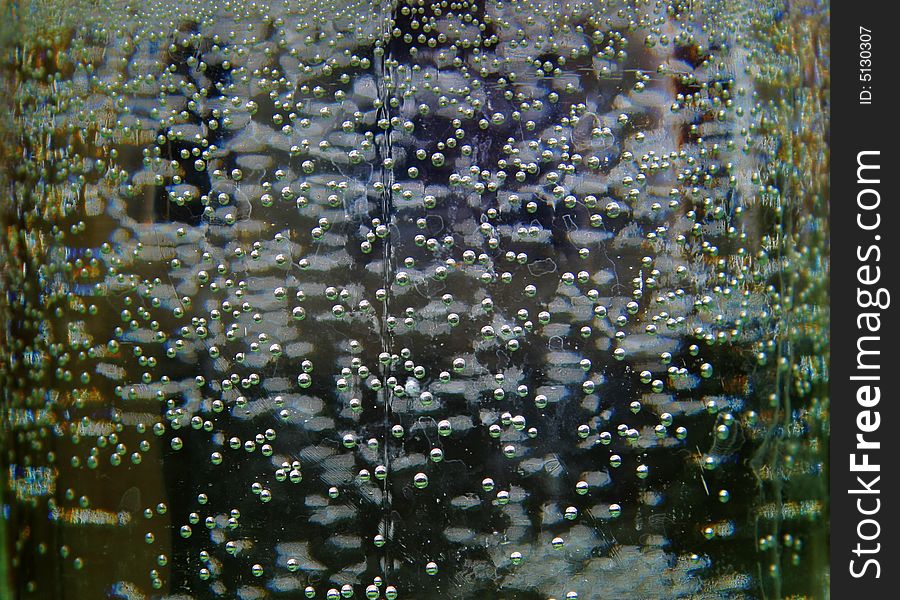 Bubbles on walls glass banks on a dark background