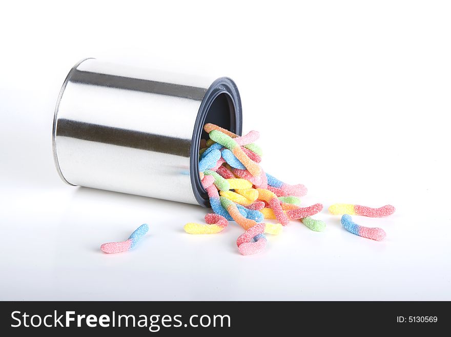 Shiny can of candy worms isolated against a white background. Shiny can of candy worms isolated against a white background