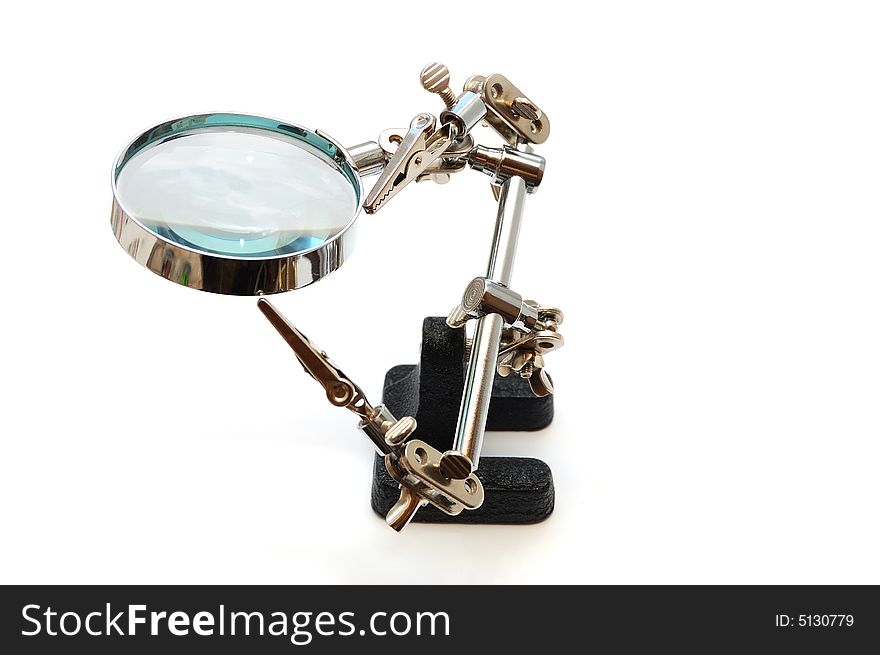 Magnifier with clips- The third hand on white background