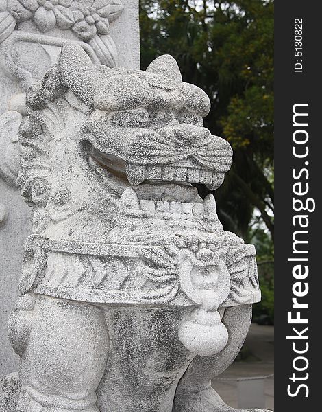Dragon / lion carving near the Big Buddha in Hong Kong. Dragon / lion carving near the Big Buddha in Hong Kong