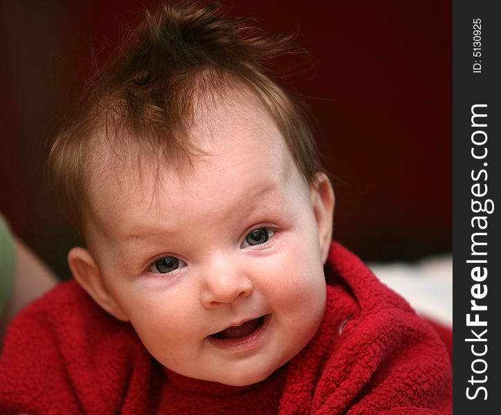 A smiling face of a four months old baby girl