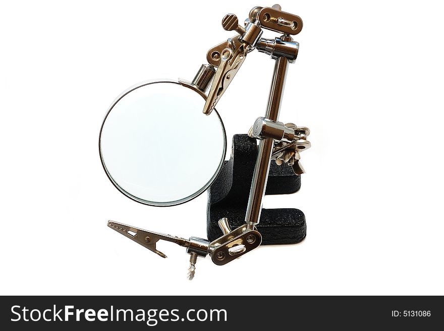 Magnifier with clips- The third hand on white background in vertical orientation. Magnifier with clips- The third hand on white background in vertical orientation