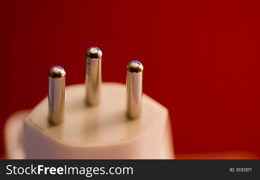 Power plug isolated on a red background. Power plug isolated on a red background