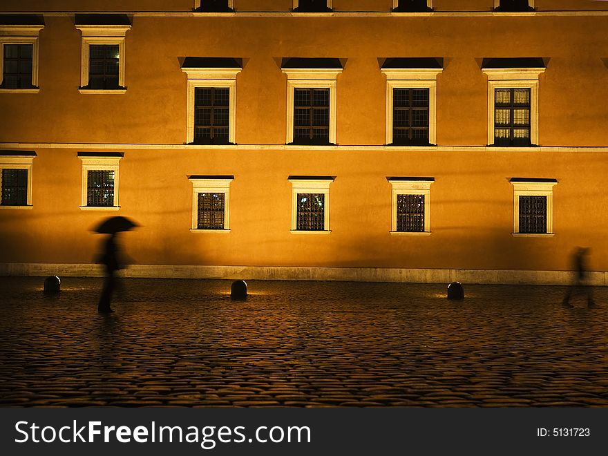 Man with umbrella at night