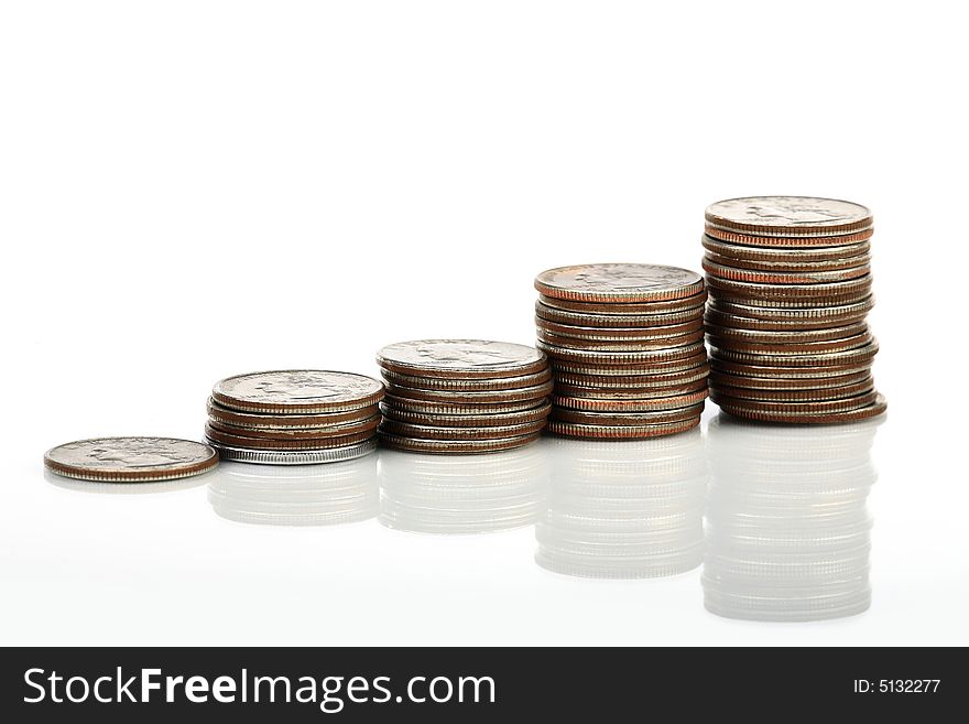 Five pile of coins forming a graphic pattern. Five pile of coins forming a graphic pattern