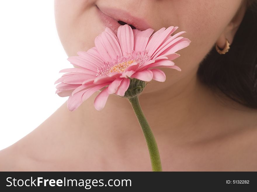 Girls lips touching a flower gently. Girls lips touching a flower gently.