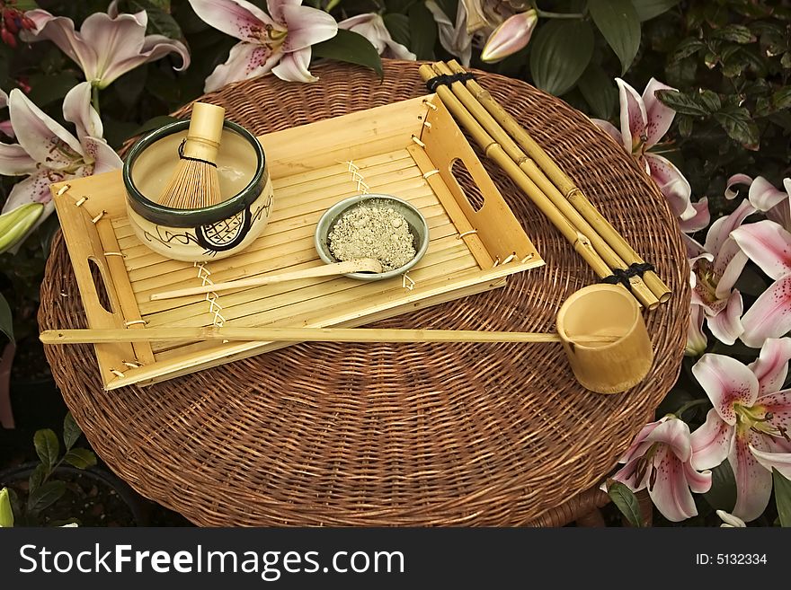 Traditional Japanese Tea Set surrounded by flowers