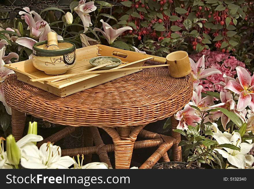 Traditional Japanese Tea Set surrounded by flowers