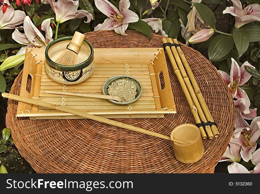 Traditional Japanese Tea Set surrounded by flowers