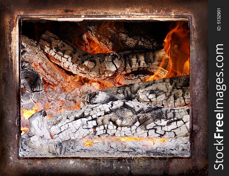 Fire burning in rustic wood exterior oven. Fire burning in rustic wood exterior oven