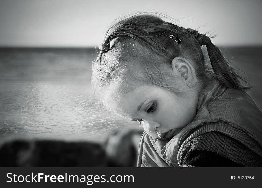 Girl and the sea. Monochrome portrait