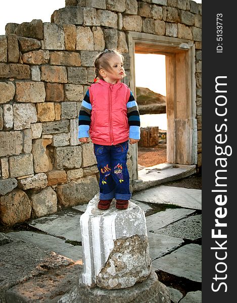 Portrait of the girl on a background of ruins of Chersonese