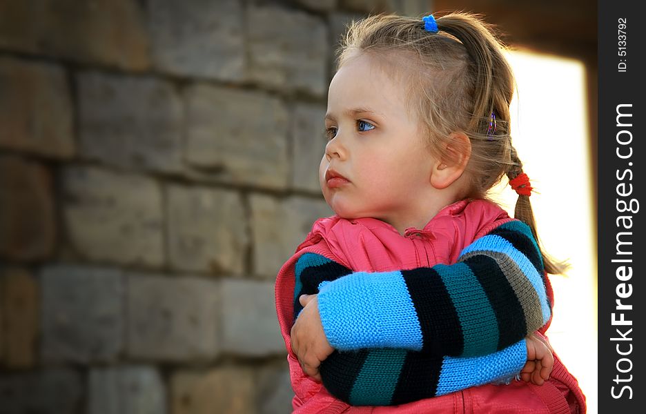 Portrait of the little girl walks in the spring