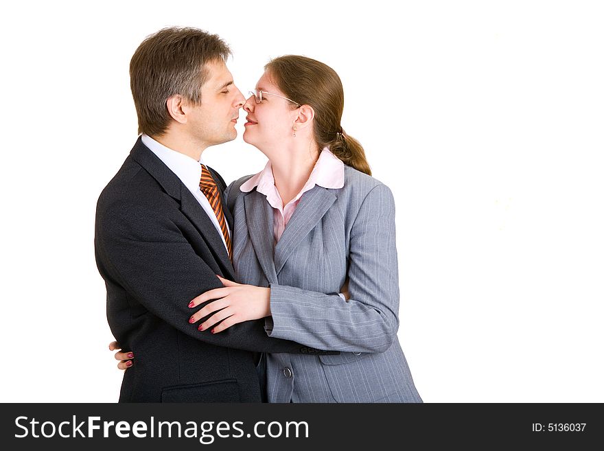 A businessman and woman kissing. A businessman and woman kissing