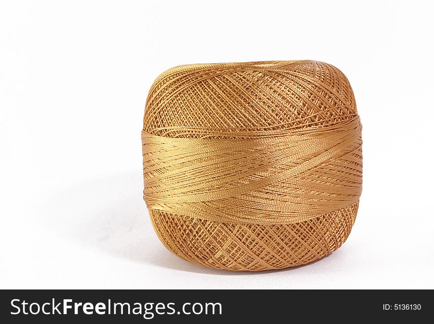 Golden threads ball for knitting. Golden threads ball for knitting