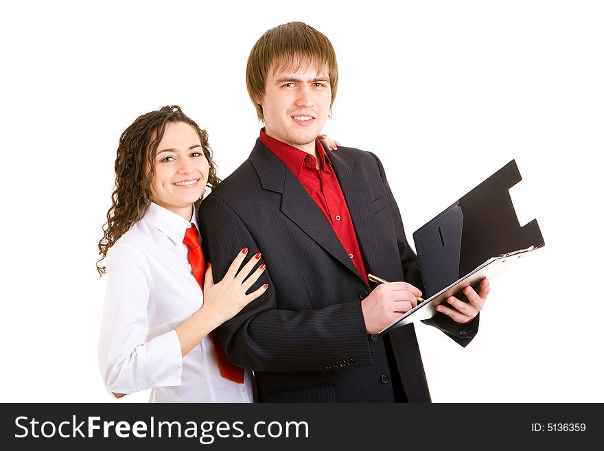 Smiling man and woman dressed for office stand with carpet. Smiling man and woman dressed for office stand with carpet