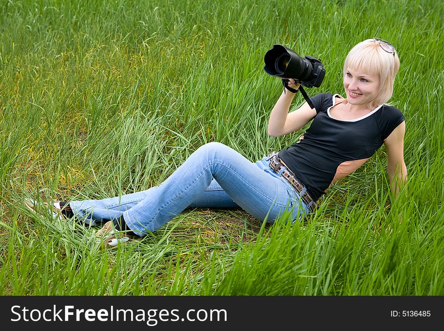 Pretty blond girl with photo camera. Pretty blond girl with photo camera