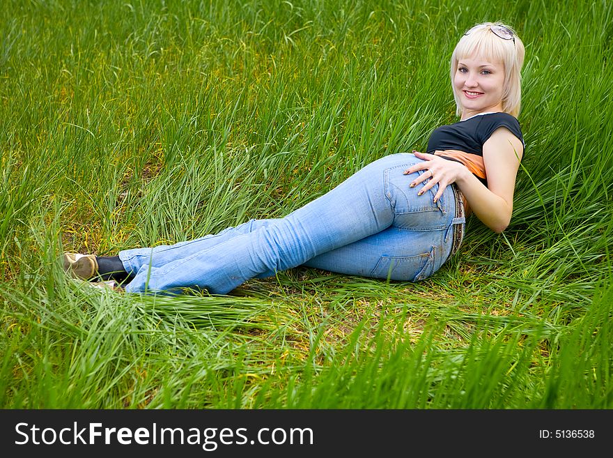 Blond beauty on the grass. Blond beauty on the grass