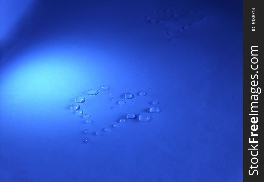 Water herat on blue table. Water herat on blue table.