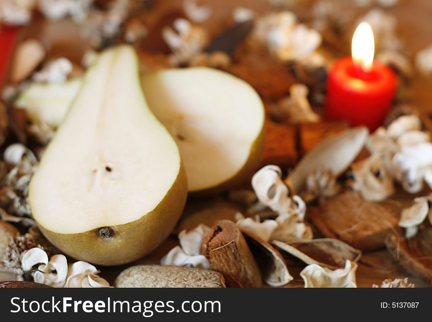 Burning candle, Pear and Dried Plants