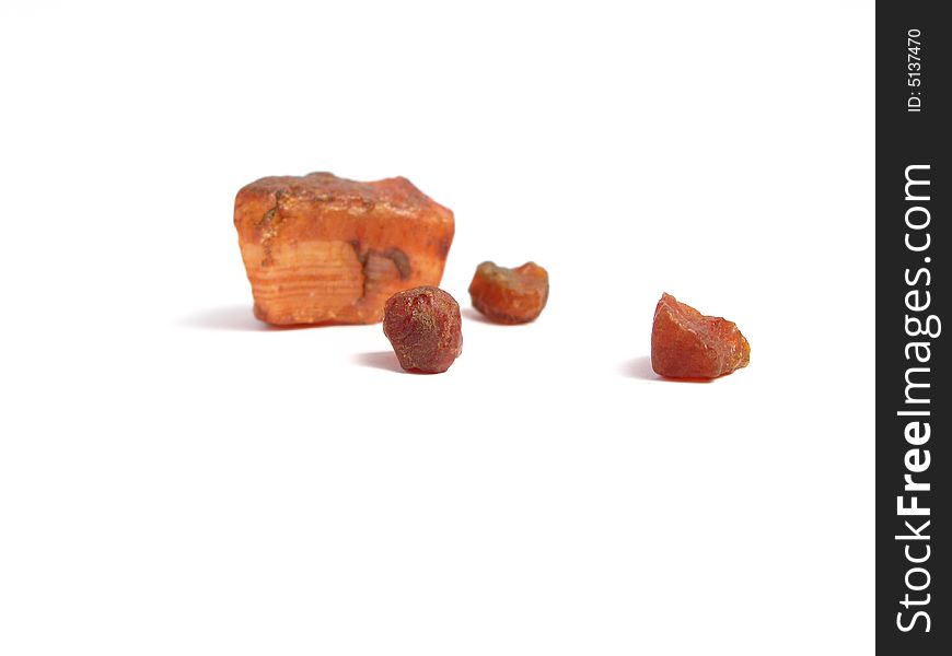 Group of red stones in a white background